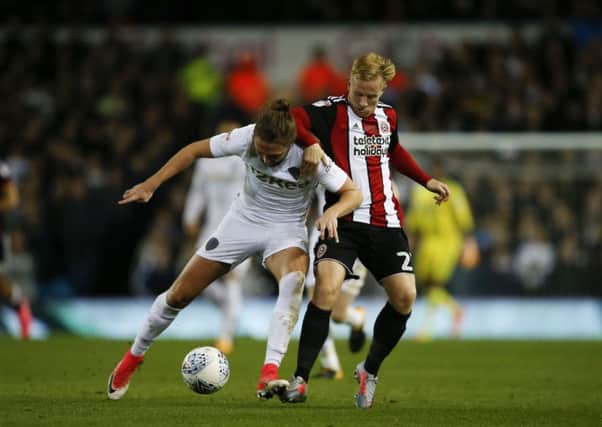 ON THE UP: Mark Duffy battles with Luke Ayling in last Friday's 2-1 win for Sheffield United at Elland Road. Picture: Simon Bellis/Sportimage