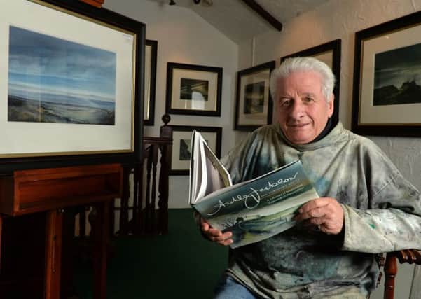 Ashley Jackson in his Holmfirth gallery with his new book. (Picture: Bruce Rollinson).