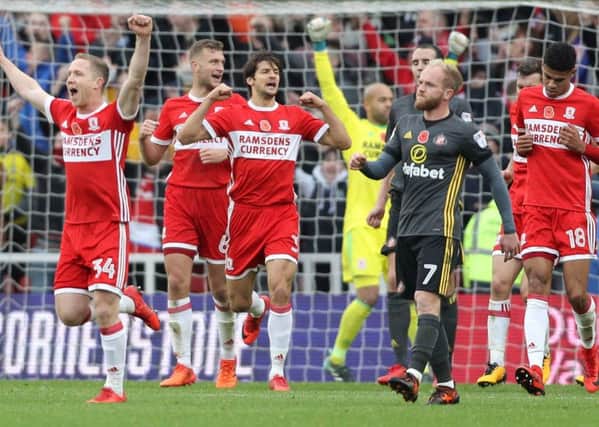 Middlesbrough's Adam Forshaw (left) and team-mates celebrate victory against Sunderland. PIC: PA