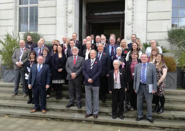 Barnsley councillors and MPs gather outside Barnsley Town Hall after the vote.