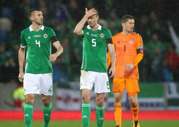 Northern Ireland's Jonny Evans and Gareth McAuley (left) mortified as a dubious penalty left Northern Ireland with a mountain to climb.