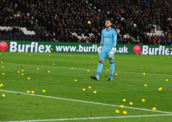 Jordan Smith among the sea of yellow balls during Hull City fan' protest during the game against Nottingham Forest. Picture: Bruce Rollinson.