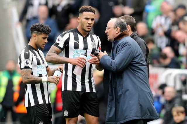 Newcastle United manager Rafael Benitez (right) gives instructions to Newcastle United's Jamaal Lascelles (centre) during a Premier League match at St James' Park, Newcastle. PA