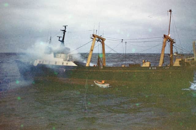 The rescue crew fighting to board the blazing St Finbarr as the wind rolls the vessel. Credit: Family of George William Lee  (deceased) and Mrs Jill Long, widow of St Finbarr deckhand Tony Harrison