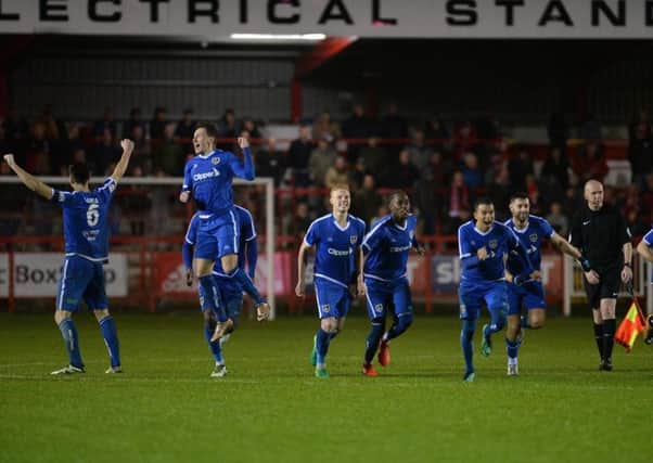Guiseley players celebrate their penalty shoot-out victory over Accrington Stanley in last nights FA Cup tie (Picture: Bruce Rollinson).