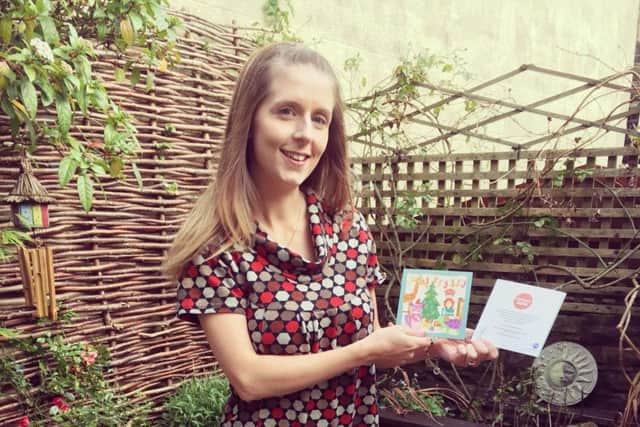 April with the Christmas cards inspired by her goddaughter Clara Fox who died of meningitis
