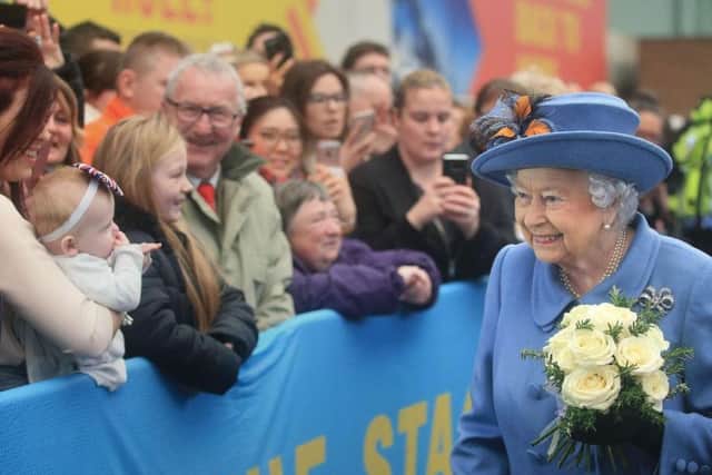 Queen Elizabeth II meets the crowds at Hull Railway Station. Baby Maisie was there with mum Amy Tinley (far left).