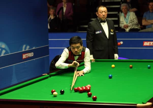 Ding Junhui in action against Martin Gould at last year's World Championships at the Crucible  in Sheffield last year. Picture: Simon Cooper/PA.