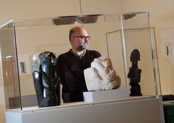 OBJECTS OF DESIRE: Curator Sebastiano Barassi surrounded by works in the Becoming Henry Moore exhibition at the Henry Moore Institute, in Leeds. PIC: Simon Hulme