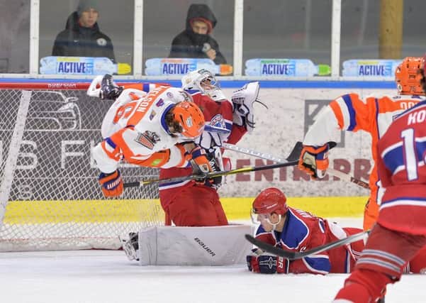 Over but not quite out: Sheffield Steelers Levi Nelson tumbles through mid-air close to the Yunost Minsk net. Picture: dean woolley