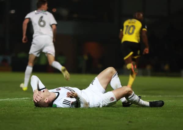 Sheffield Uniteds Paul Coutts was stretchered off with a broken leg last night following a challenge with Burton Albions striker Marvin Sordell (Picture: Mike Egerton/PA).