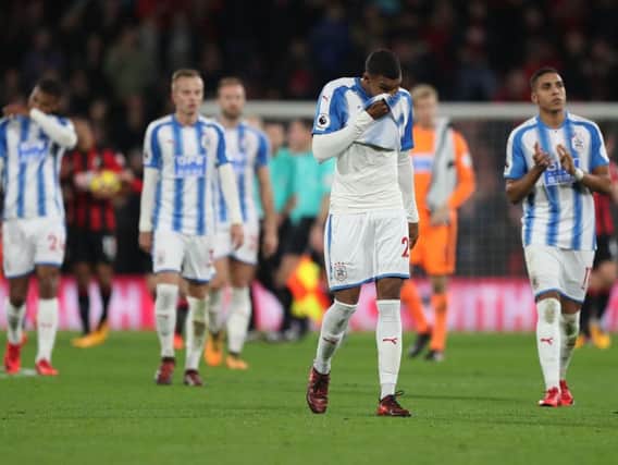 Huddersfield Town's players walk off after their 4-0 defeat at Bournemouth. Picture: PA