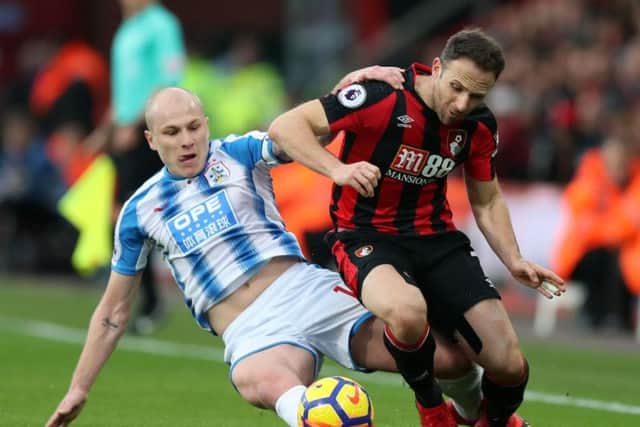 Aaron Mooy battles for possession at Dean Court. Picture: PA.