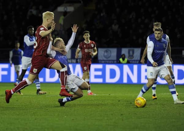 TSheffield Wednesday were left frustrated as the referee waved away a shout for a penalty as Barry Bannan falls under contact from Bristol Citys Joe Bryan. (Picture: Steve Ellis)