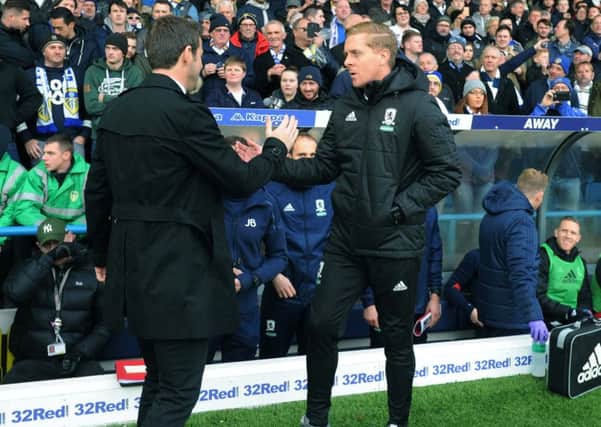 THE OLD AND THE NEW: Garry Monk, right, and Thomas Christiansen shake hands at Elland Road.