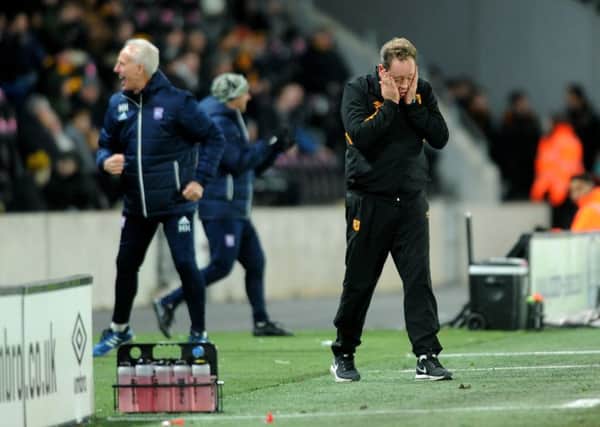 Hull City manager Leonid Slutsky is disappointed while Ipswich Town counterpart Mick McCarthy celebrates his sides late goal that earned a Championship draw (Picture: Jonathan Gawthorpe).
