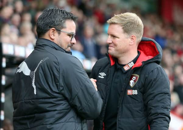 Huddersfield Town manager David Wagner, left, and AFC Bournemouth manager Eddie Howe shake hands before kick-off (Picture: Andrew Matthews/PA Wire).