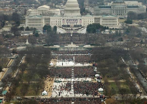 Attendees line the Mall as they watch ceremonies to swear in Donald Trump on Inauguration Day on January 20, 2017. Picture: National Science and Media Museum