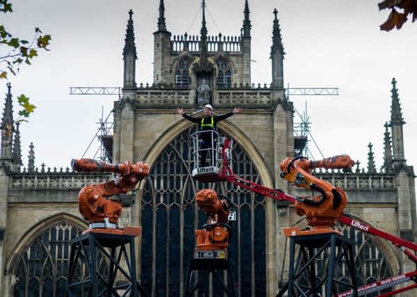 LET THERE BE LIGHT: Jason Bruges oversees as robots are installed in Hull for Where Do We Go from Here? PIC: James Hardisty