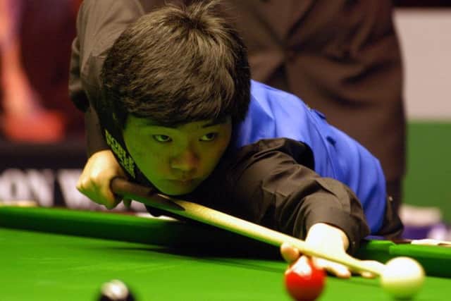China's Ding Junhui in action against England's Steve Davis during the Travis Perkins UK Championship Final at the Barbican Centre in York, Sunday December 18, 2005.