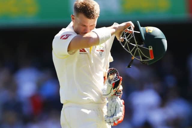 Australia's David Warner walks off after being dismissed  during day two of the Ashes Test match at The Gabba