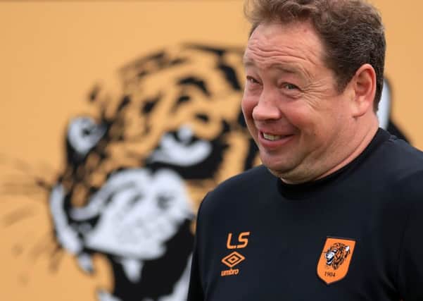 Hull City manager Leonid Slutsky poses for photographs after a press conference