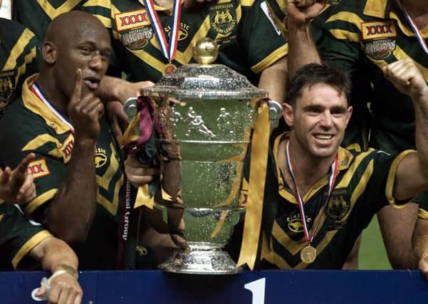 Australia's Wendell Sailor (left) and captain Brad Fittler celebrate after defeating New Zealand 40-12 to win the Rugby League World Cup at Old Trafford, on November 25, 2000. Picture: Phil Noble.