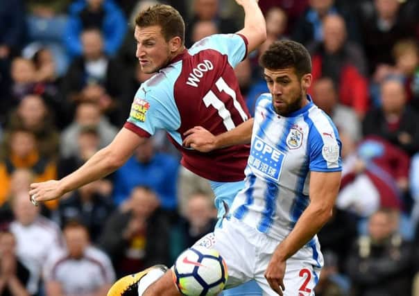 Huddersfield Town's Tommy Smith battle s with Burnley's Chris Wood (Picture: Anthony Devlin/PA Wire).