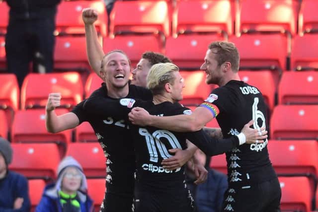 Ezgjan Alioski, of Leeds United, celebrates with team-mates after scoring the second goal