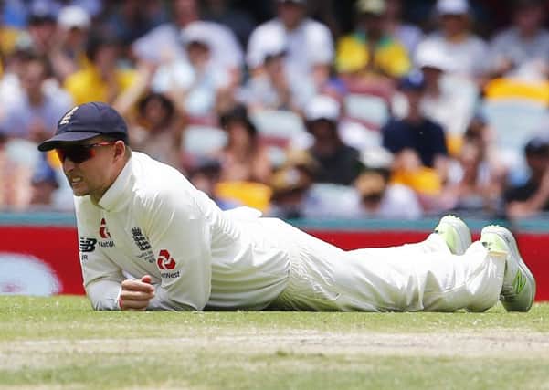 England's Joe Root looks dejected in the field during day five at The Gabba: Jason O'Brien/PA