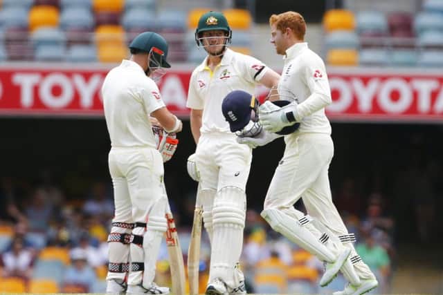 HEADS UP: England's Jonny Bairstow and Australia's Cameron Bancroft during day five of the Ashes Test match at The Gabba. Picture: Jason O'Brien/PA