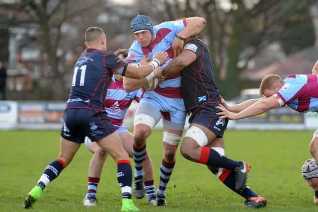 TOUGH TO SWALLOW: Rotherham's Adam Peters tries to break through the London Scottish defence. Picture: Scott Merrylees