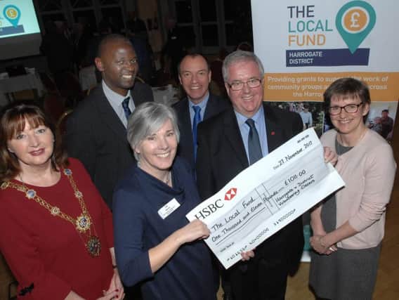 Chair of the Volunteer Oscars John Fox presents a cheque to Jan Garrill of The Local Fund. Also in the picture are The Mayor of Harrogate Coun Anne Jones, Chief Executive of Harrogate Borough Council Wallace Sampson, Council Leader Coun Richard Cooper and Chief Executive of HARCVS Karen Weaver.