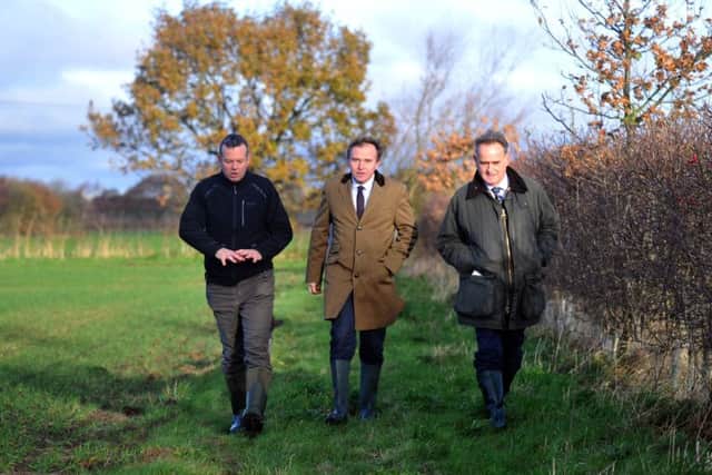 Left to right: Farmer Richard Bramley, Farming Minister George Eustice and Geoff Sansome, head of agriculture for Natural England, at Manor Farm.