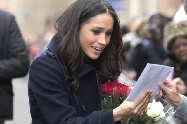 Meghan Markle meets well-wishers as she arrives with Prince Harry in Nottingham
