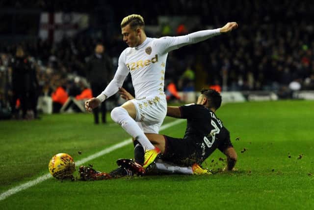 IN TOUCH: Leeds United's Gianni Alioski is tackled by Aston Villa's Neil Taylor.
 Picture: Jonathan Gawthorpe