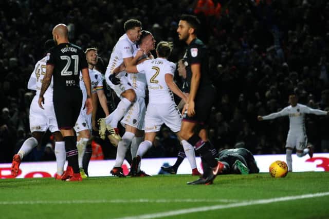 Pontus Jansson is mobbed by Leeds United team-mates after giving them a deserved lead against Aston Villa (Picture: Jonathan Gawthorpe).