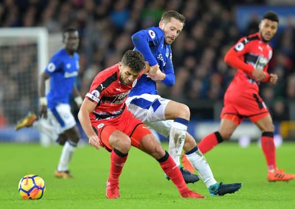 Huddersfield Town's Tommy Smith (left) and Everton's Gylfi Sigurdsson in action.