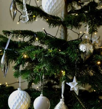 The tree with lights and Bloomingville baubles from Lucy MacNicoll Floral Design in Harrogate