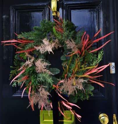 The wreath on the front door, which is painted in Little Green's Basalt. The wreaths are available from Lucy's shop, where she also runs wreath making workshops.