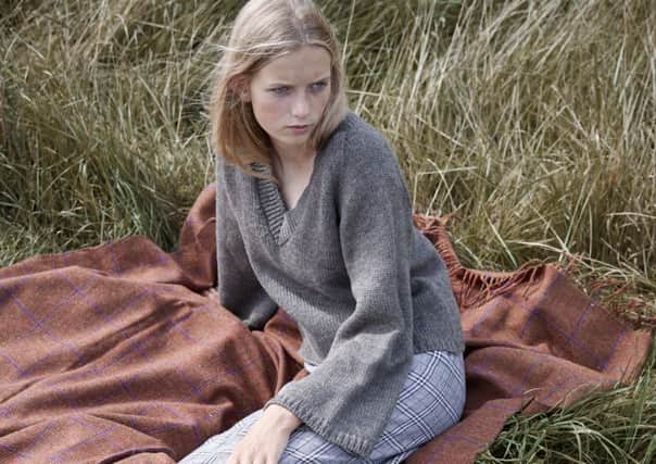 Flared sleeve jumper, Â£165; skirt from a selection at Izzy Lane. All made from the herd of rescue sheep.