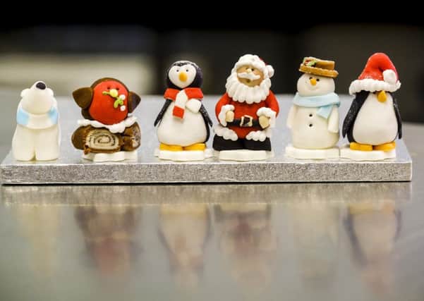 Christmas figures hand made from sugar paste and marzipan wait to be placed on Christmas cakes at Botham's of Whitby. PIC: Tony Bartholomew/Turnstone Media