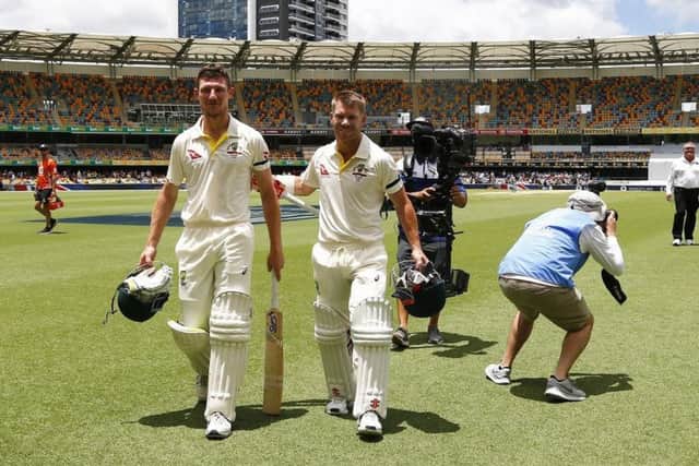 Australia's Cameron Bancroft, a controversial selection among some former players, and David Warner and Cameron Bancroft celebrate winning the first Ashes Test at The Gabba by 10 wickets. Picture: Jason O'Brien/PA