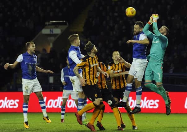 STALEMATE: Hull City goalkeeper Alan McGregor punches the ball clear of Sheffield Wednesday's Atdhe Nuhiu. Picture: Steve Ellis
