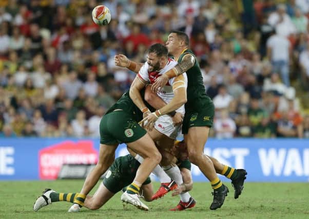 England's Alex Walmsley is tackled during the Rugby League World Cup final between Australia and England at the Suncorp Stadium. Picture: Tertius Pickard/SWpix.com/PhotosportNZ