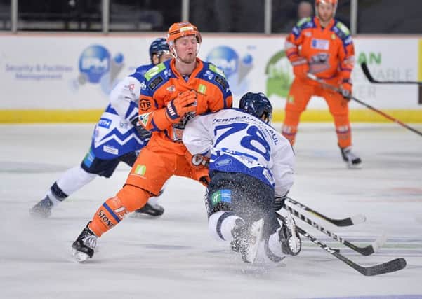 COLLISION COURSE: Sheffield Steelers defenceman Davey Phillips gets in the path of Milton Keyness Francis Verreault-Paul at Sheffield Arena last night.Picture: Dean Woolley