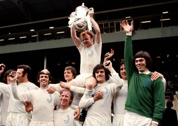 Leeds United captain Billy Bremner celebrates winning the FA Cup in 1972 with his Leeds team-mates. Picture: PA