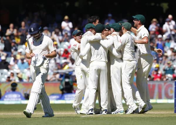 Australian players celebrate the final wicket of Jonny Bairstow to win the 2nd Test.