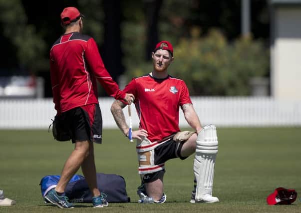 England cricketer Ben Stokes, right, talks to Canterbury coach Gary Stead during a training session in Rangiora, near Christchurch. Picture: AP/Mark Baker.