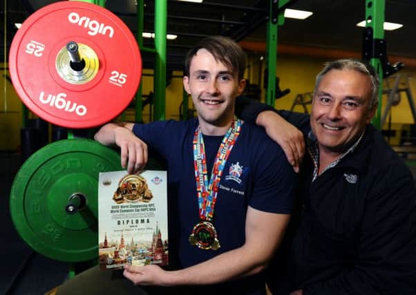 World Junior Powerlifting Champion Steve Forrest, with his dad Steven.